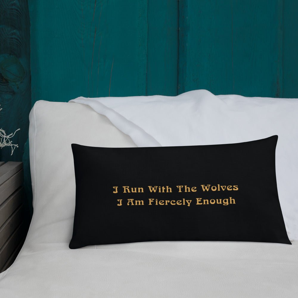 Black Rectangle STRONG WOLF PILLOW with WRITING ON BACK | I Am Enough Collection - Backside says I run with the wolves, I am fiercely enough.  It's sitting on a white sofa with a teal background.