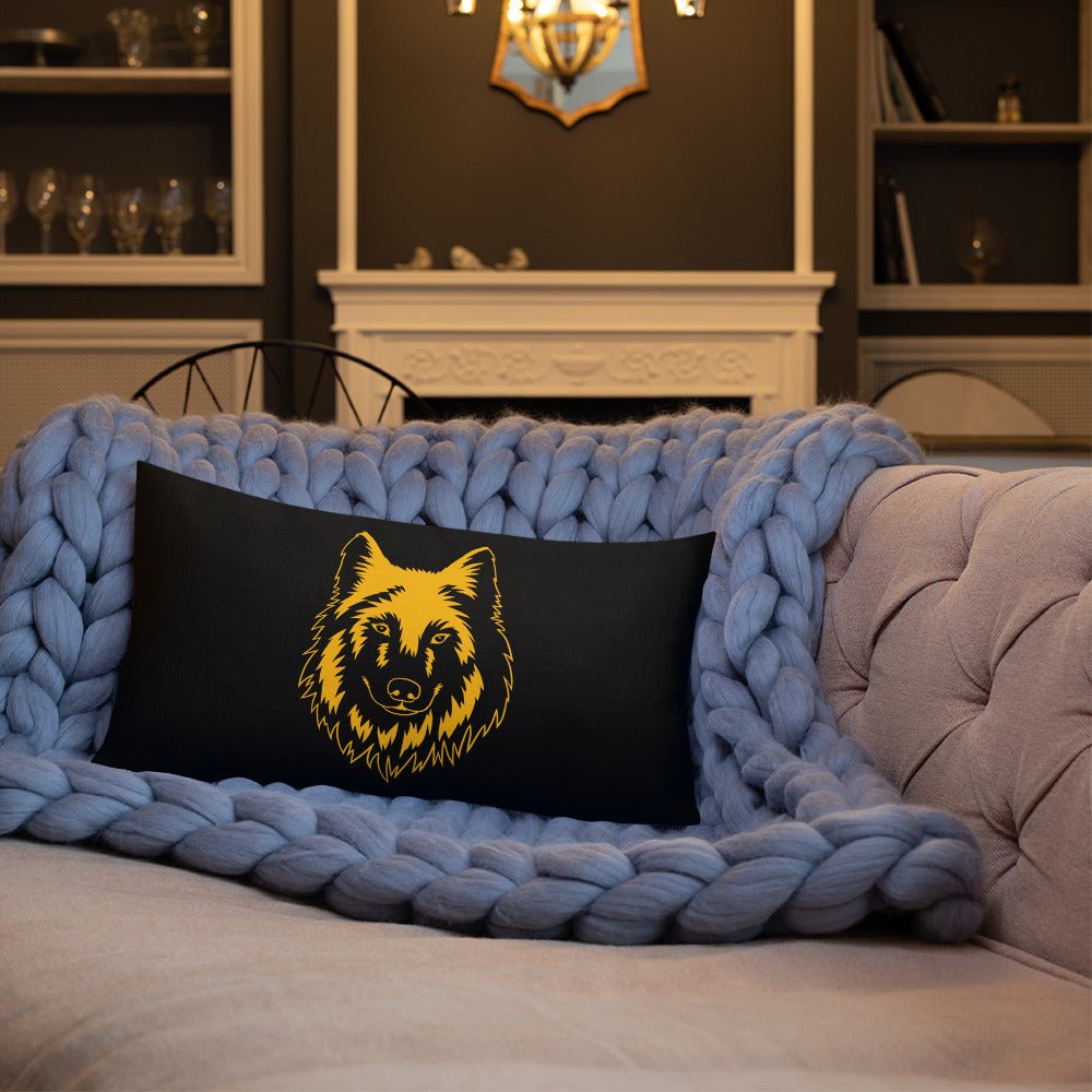 Black rectangle STRONG WOLF PILLOW with WRITING ON BACK | I Am Enough Collection sitting on a tan sofa and a blue knit blanket in a great room.